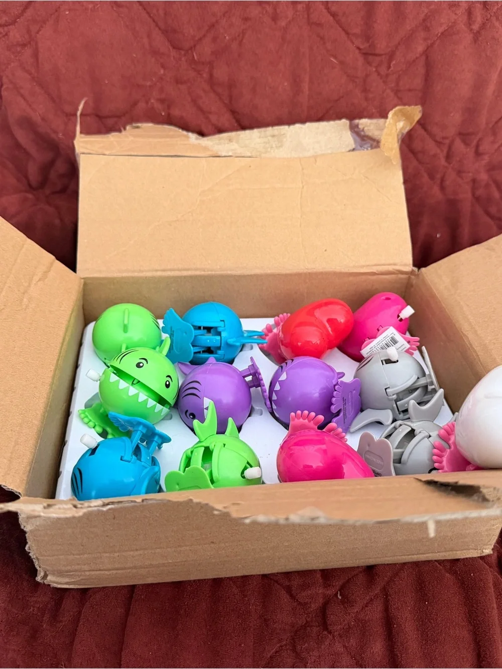 Assorted colors of sharks and hearts wind up toys .